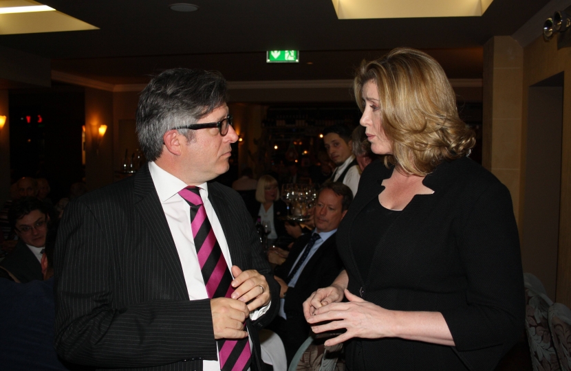 Mark Brooks OBE pictured above with the Rt Hon Penny Mordaunt MP Secretary of State for International Development at a function in Stuzzichini Restaurant, Bexleyheath