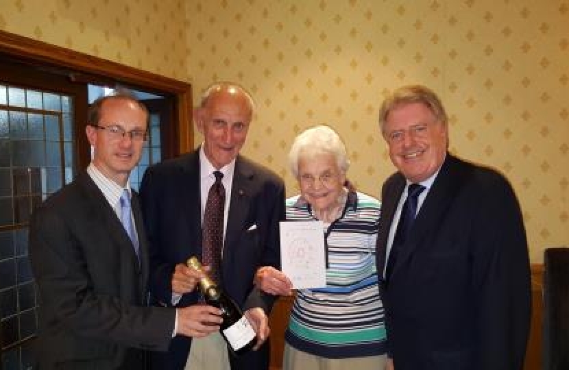 Association Chairman, Simon Windle, and David Evennett MP celebrate with Bernard and Edna Clewes.