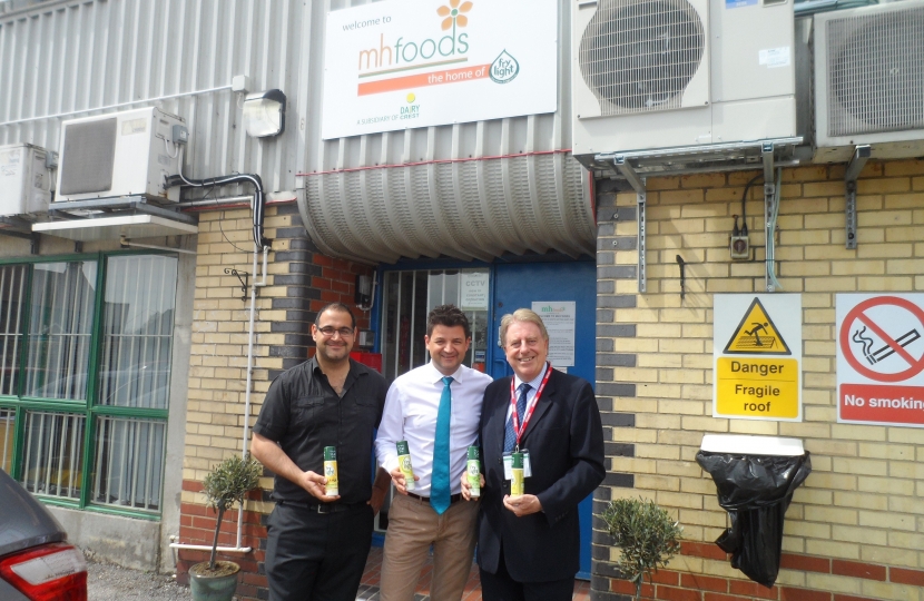 David Evennett MP with Akar Necai, an employee at the factory, and Paul Fraser.
