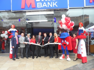 David Evennett MP pictured cutting the ribbon to open the branch.